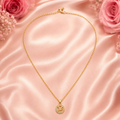 Cadena de oro con dije redondo